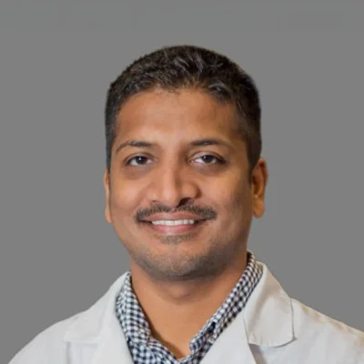 A headshot photo of Dr. Manoj Abraham